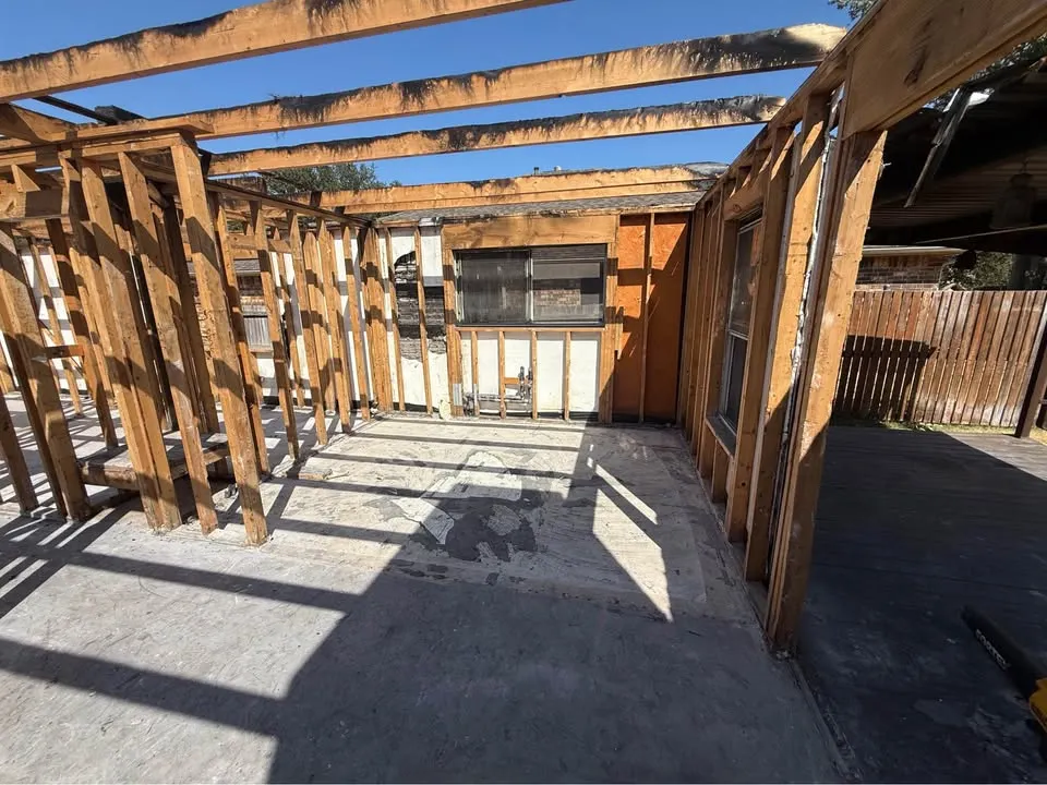 House stripped to its wood frame with the roof removed on a Toronto residential lot