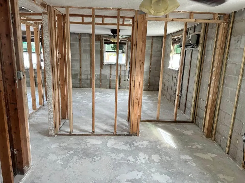 Basement area with partition walls stripped to studs