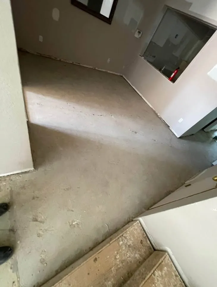 Room with carpet removed and baseboard trim pulled