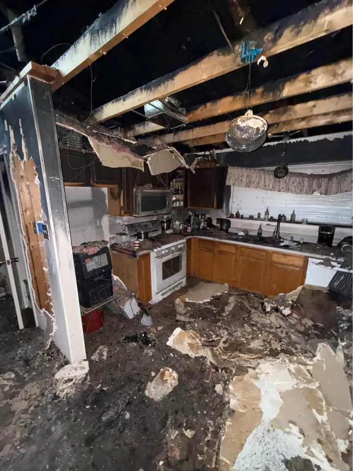 Fire-damaged kitchen with the ceiling burned through