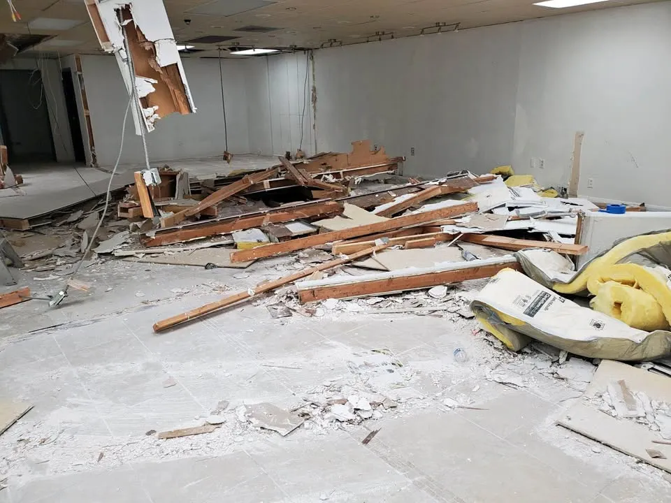 Office interior with walls torn out during a commercial strip-out that may require a Notice of Project